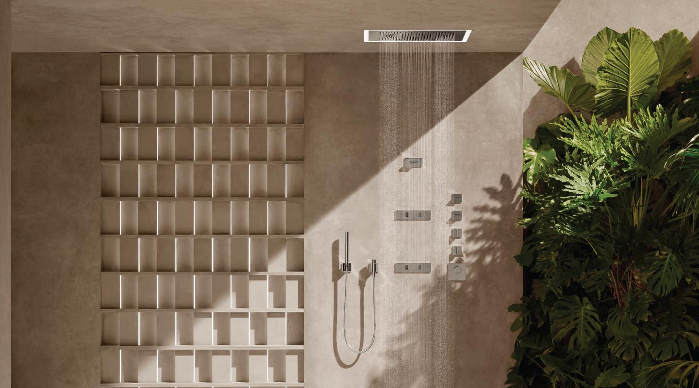 Ceiling-mounted rain shower head with body jets in a stone shower